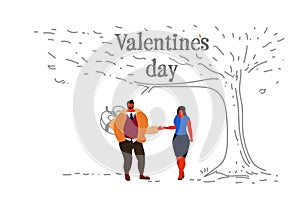 Couple in love happy valentines day concept boyfriend hiding surprise gift box behind back man woman lovers holding