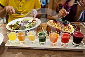 Couple in love are having dinner in a restaurant with beautiful dishes and a set of fresh juices