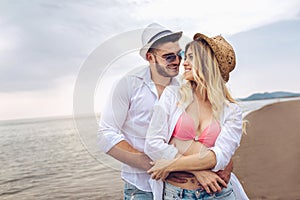 Couple in love having fun dating on beach.