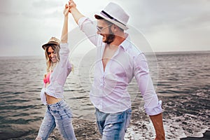 Couple in love having fun dating on beach.