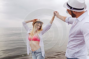 Couple in love having fun dating on beach