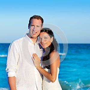 Couple in love hug in blue sea vacation