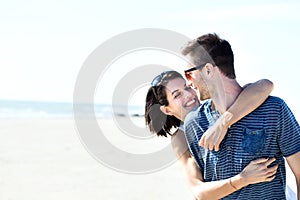 Couple in love hugging affectionately in front of the sea