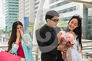 Couple in love with jealous friend