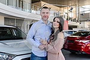 Couple in love with keys from new car