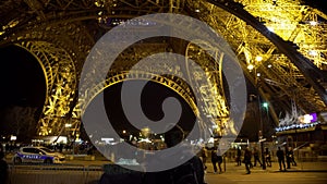 Couple in love looking at bottom of Eiffel Tower, enjoying moment of happiness