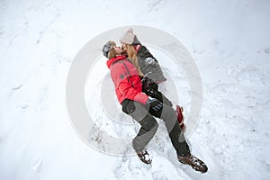 Couple in love lying in the snow