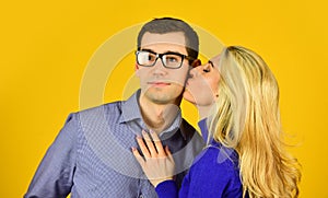 Couple in love. man and woman embrace. smart looking guy wear glasses. sexy bonde girl kiss and hug her boyfriend. happy photo