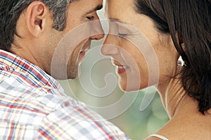 Couple in love - moment of intimacy between middle aged man and woman