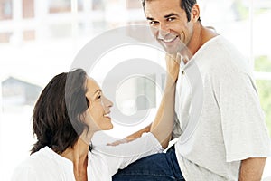 Couple in love - moment of intimacy between middle aged man and woman