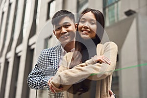 Couple in love near glass barrage.