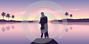 Couple in love by the ocean at sunset with mountain and palm tree view