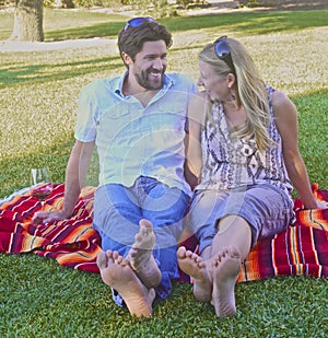 Couple in love picnicking in the park photo