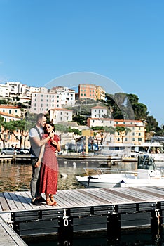 Couple in love on a pier of the seaside