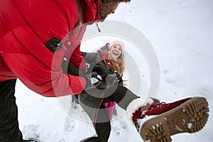 Couple in love playing in the snow