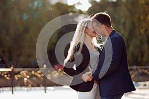 Kiss. Couple in love. Portrait of attractive happy girl and the guy