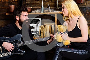 Couple in love on relaxed faces enjoy romantic atmosphere. Romantic date concept. Couple spend romantic evening, wooden