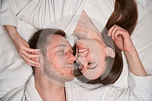 Couple in love resting in their bedchamber