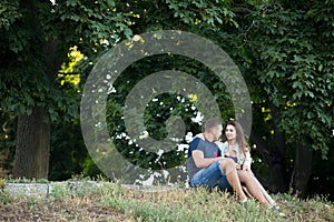 Couple in love resting under the trees