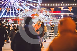 Couple in Love. Romantic Characters for Feast of Saint Valentine. True love. Happy Couple Having Fun at city ice rink in