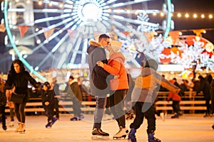 Couple in Love. Romantic Characters for Feast of Saint Valentine. True love. Happy Couple Having Fun at city ice rink in the