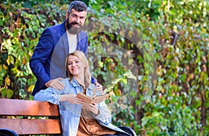 Couple in love romantic date nature park background. Girl sit bench read book while wait boyfriend. Wait him for date