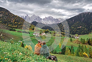 couple in love in Santa Maddalena village. Dolomites mountains