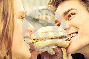 Couple in Love sharing an Hot Dog