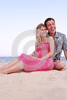 Couple in love on the shore of the sea