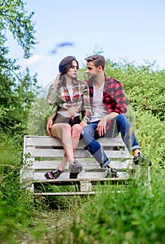 Couple in love sit on bench. Boyfriend and girlfriend in love. Love and romance concept. Family weekend. Romantic date