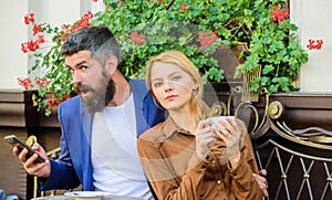 Couple in love sit cafe terrace enjoy coffee while man speak phone. Girl dating with businessman. Things know before you