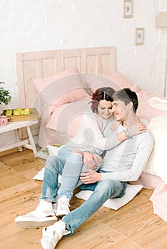 Couple in love sitting on the floor