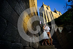 Couple in love strolling around an old castle