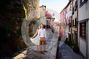 Couple in love strolling around an old castle