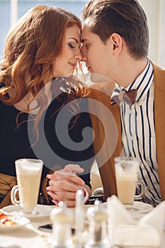 A couple in love in a summer cafe