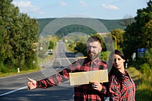 Couple in love travelling by hitchhiking, copy space.