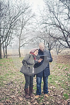 Couple in love using tablet connecting web wireless wifi