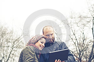 Couple in love using tablet connecting web wireless wifi