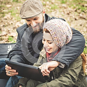 Couple in love using tablet connecting web wireless wifi