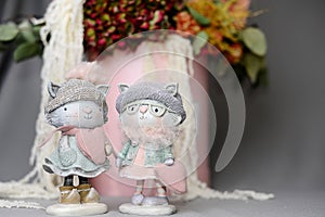 Couple in love. Valentines day concept. Cute enamored cats together holding hands. Figurines of two toy cats