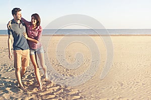 couple in love walking along the beach