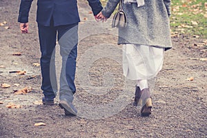 Couple in love walking and holding hands