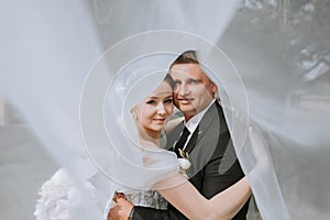 Couple, love or wedding dress veil after marriage event, ceremony or union in nature environment