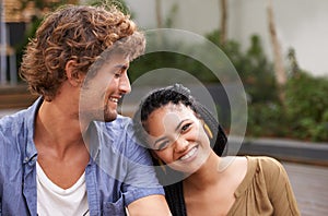 Couple, lovers and together in happiness, love and smile outdoors in garden, backyard and patio. Male person, girlfriend