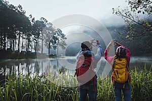 Couple lovers travel Beatiful nature at Pang ung lake and pine forest at Mae Hong Son in Thailand