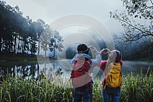 Couple lovers travel Beatiful nature at Pang ung lake and pine forest at Mae Hong Son in Thailand