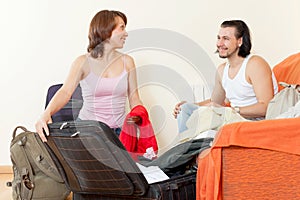 Couple with luggage in the house is going to leave a dizzying