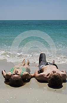 Couple Lying on Beach