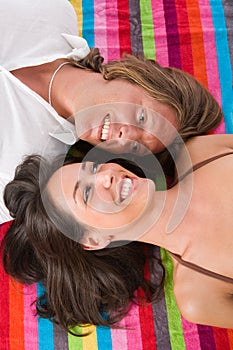 Couple lying on the beach towel