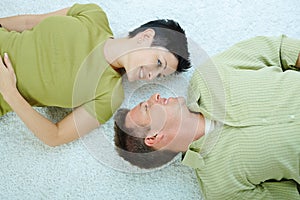 Couple lying on floor